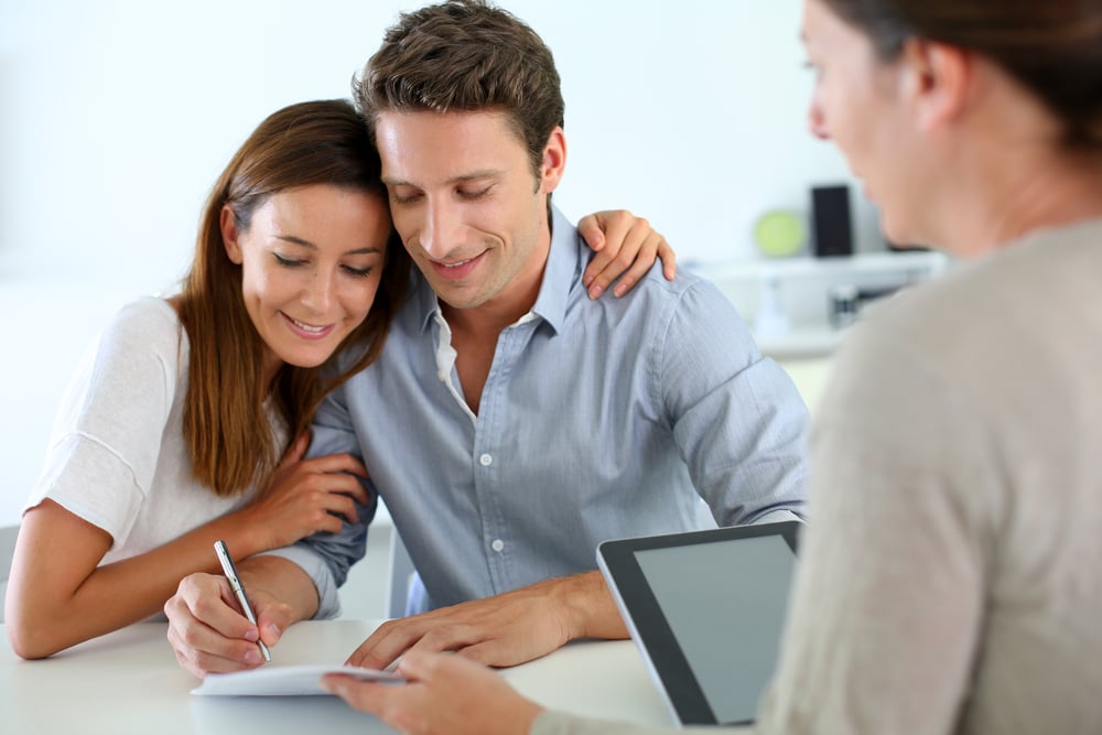 Couple signing real-estate contract